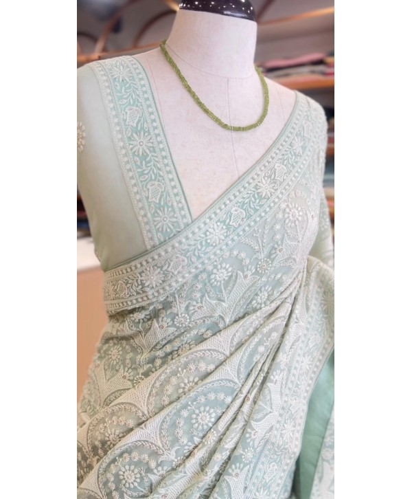 Premium Graceful sage green georgette saree featuring exquisite chikankari 